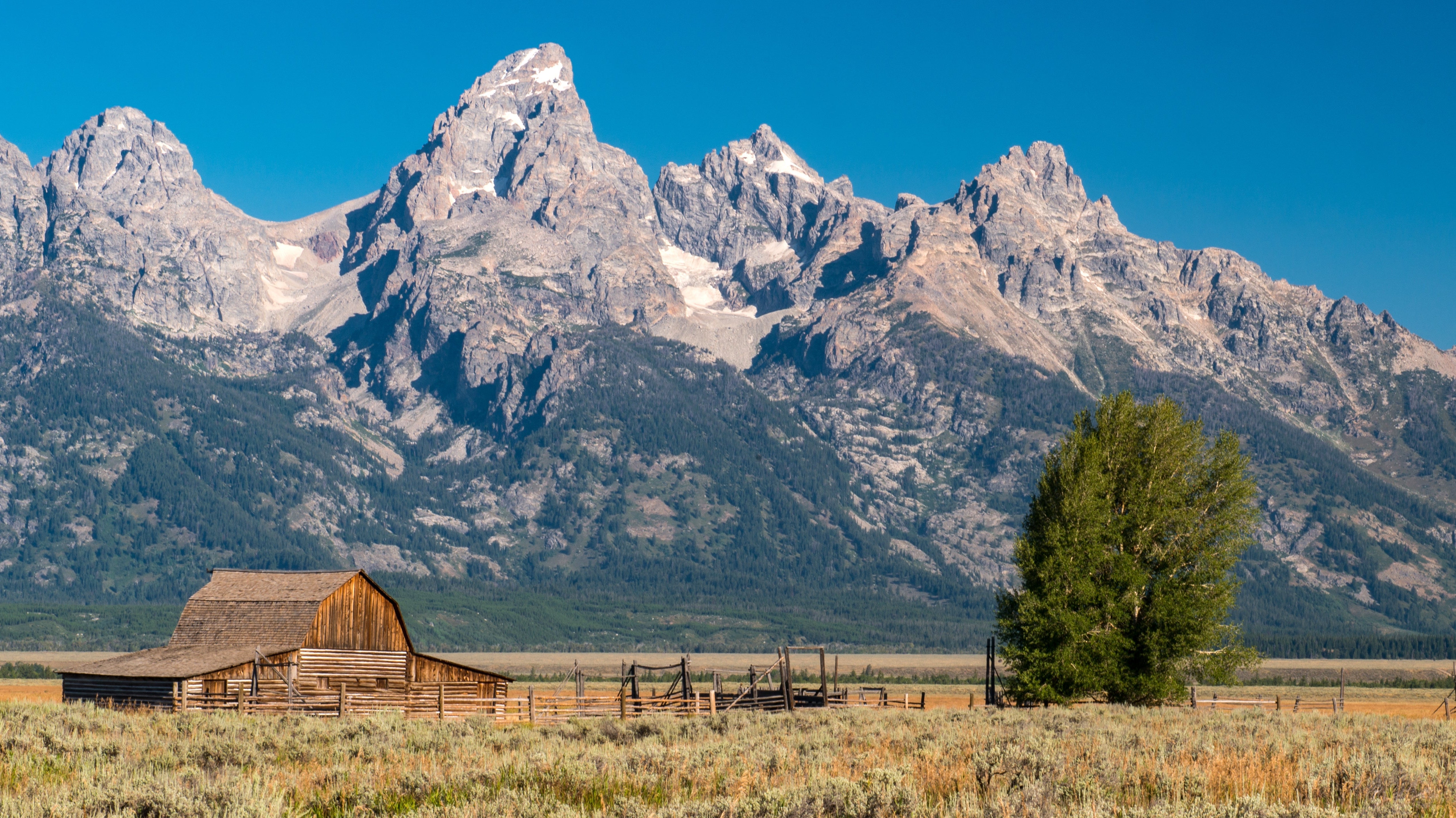 Cabin in Jackson Hole, WY with the Grand Tetons Behind it