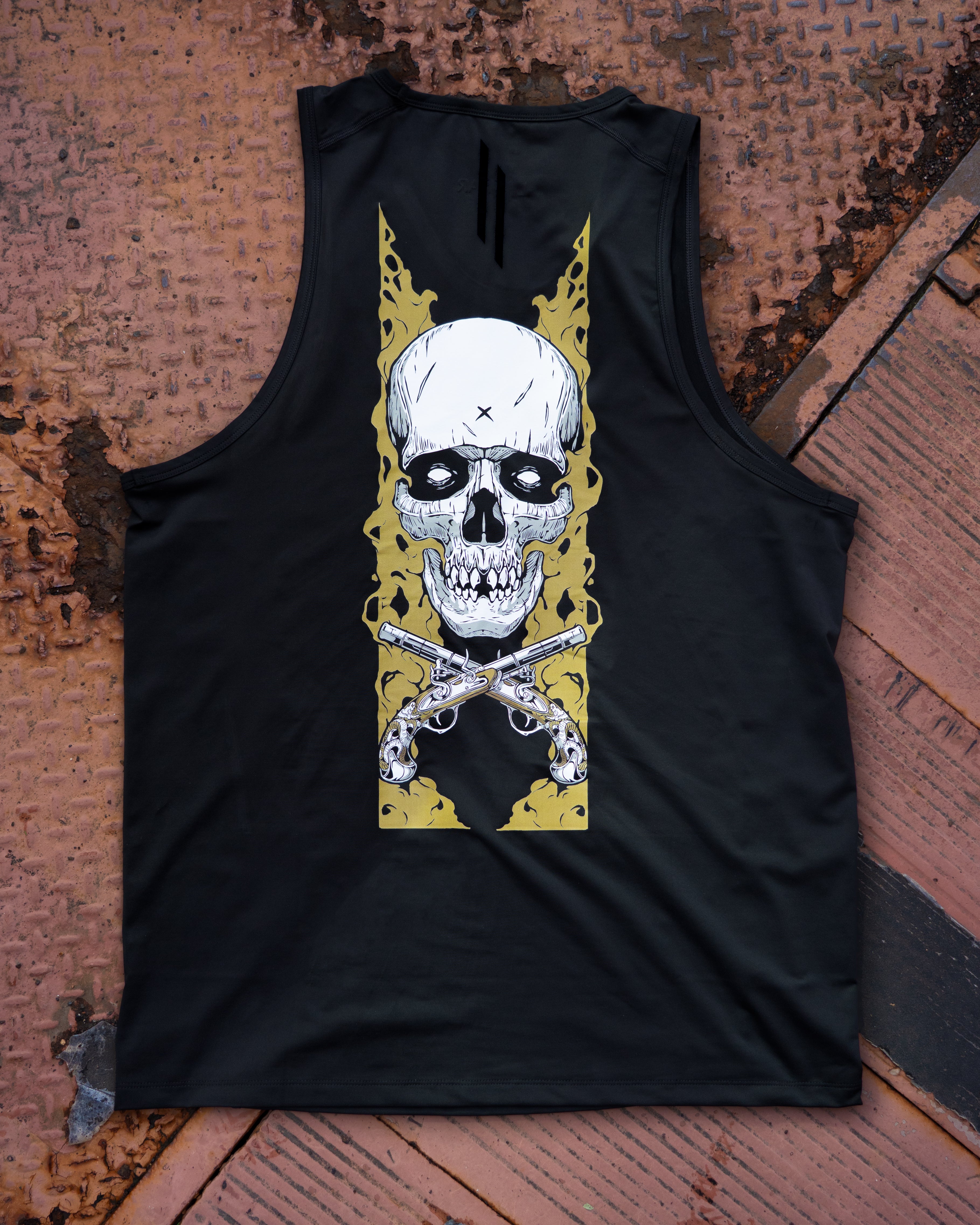 Black tank top with a skull and crossbones design on a textured surface