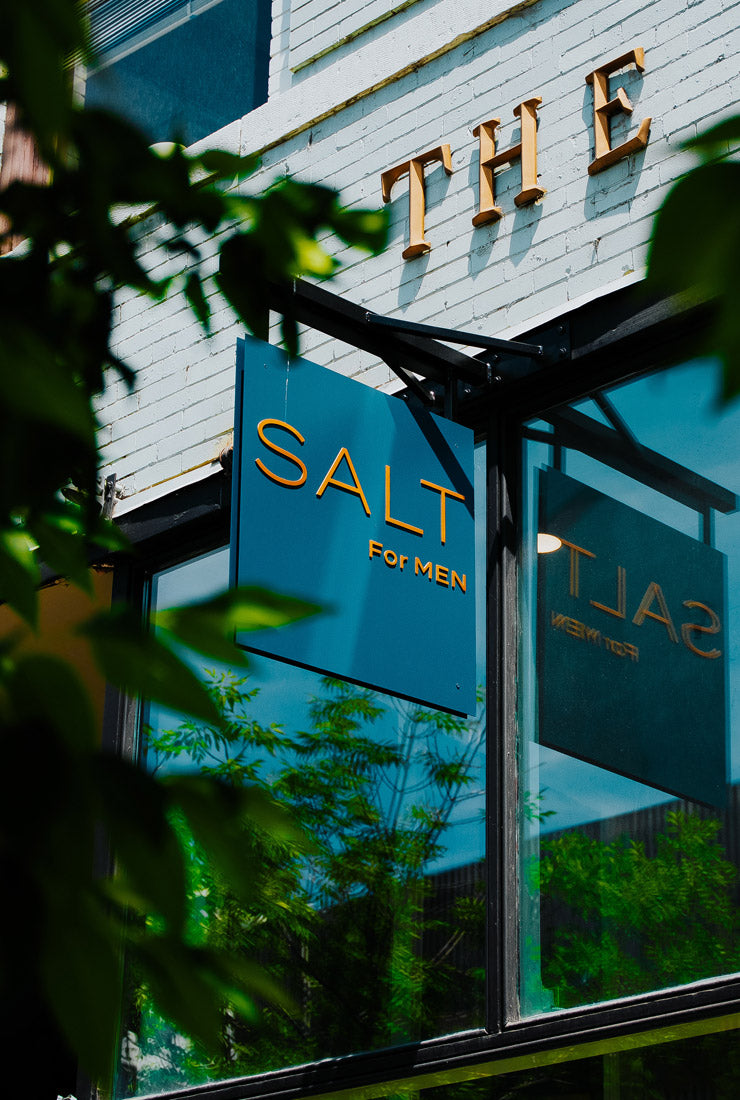 Storefront with 'The Salt for Men' sign on a building facade.